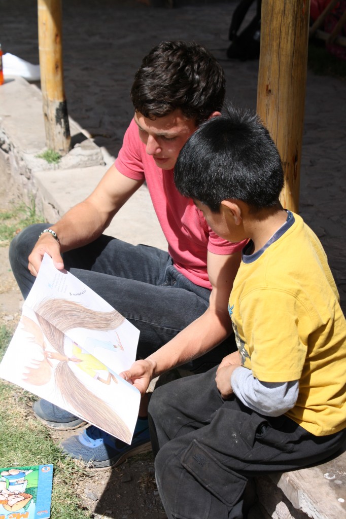 STRIVE students have reading class outside at Tambo de Gozo!