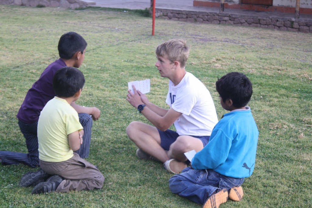 STRIVE students lead Peruvian campers in the "color race" - learning English vocab, exercising, and having fun all at once!